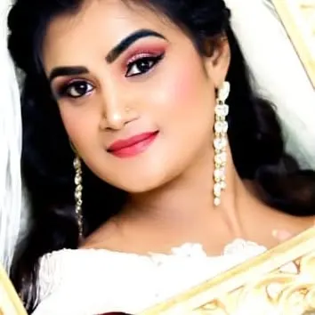 A soft and elegant look for a Christian bride or a party. The makeup is minimal yet effective, with a focus on rosy cheeks, a pink lip, and clean eye makeup.
