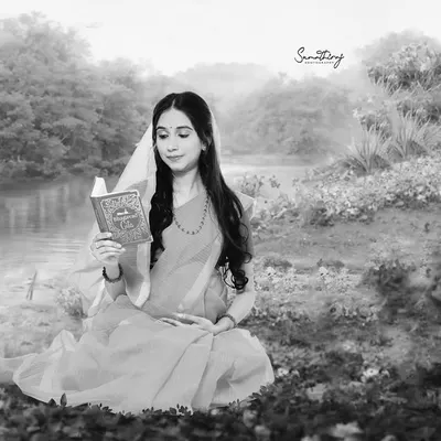 A black and white version of our Ram-Sita inspired shoot, focusing on the serene and timeless grace of the moment. This artistic choice adds a layer of classic, emotional depth to the mythological theme.
