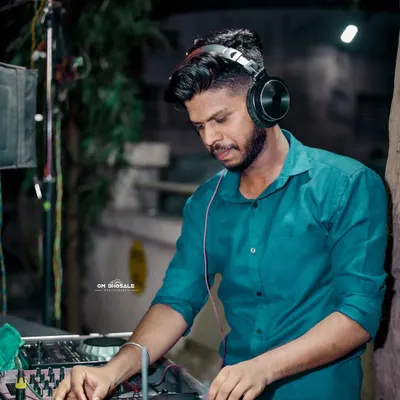 A candid shot of me focused on the mix during a night event. Every track is chosen carefully to build the energy on the dance floor.