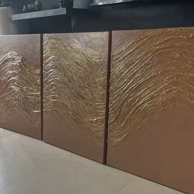 A three-panel (triptych) textured painting. I used a thick medium to create these flowing, wave-like patterns and finished it with gold accents for a rich, dynamic effect.