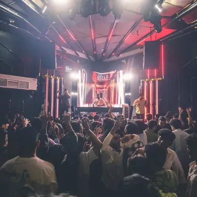 The view from my console at Flo on Church Street. A packed floor with everyone's hands up is the best feedback a DJ can get. This is the energy I bring to every Bollywood DJ night.