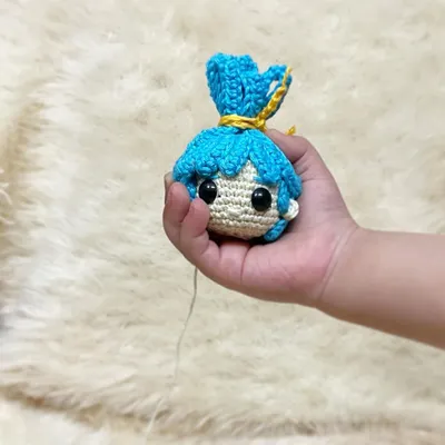 This is the head of a custom doll being held by my sweet nephew. It shows the beginning stages of a doll coming to life, even before the body is attached.