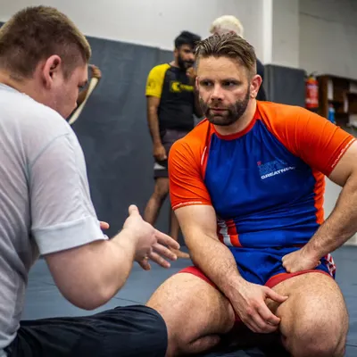 Personal feedback from a master. BJJ black belt Mike Murrell takes the time to answer a student's question during his seminar on leg locks and submission wrestling. This is the kind of direct access that accelerates learning.