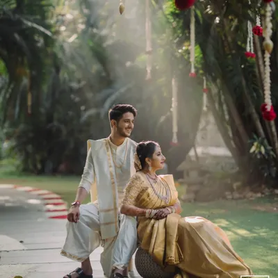 A stunning, sun-drenched portrait of a couple in a garden. The magical light and romantic pose make this a truly breathtaking image that epitomizes our style.