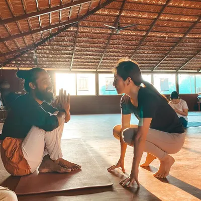 A one-on-one conversation during practice. These moments are crucial for clarifying doubts, understanding alignment on a personal level, and building the trust that is essential for true learning.