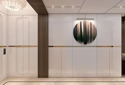 A truly grand entrance foyer. This design features seamless, high-gloss white panels with elegant gold and wood accents, creating a stunning first impression that is both modern and opulent.