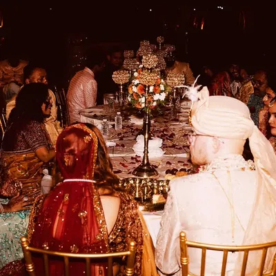 A wedding couple seated for their meal, surrounded by family and friends. It's a privilege to be a part of such important moments, ensuring the food is perfect for the occasion.
