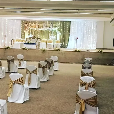 A view of our socially distanced seating arrangement for a wedding during the pandemic. We ensured guest safety by spacing chairs appropriately while maintaining an elegant and organized look with beautiful chair covers and sashes.