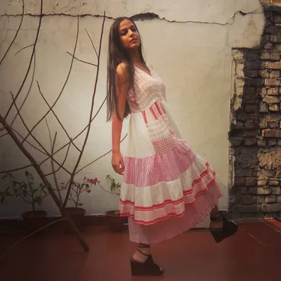 This dramatic patchwork dress is one of my own designs, created for a themed shoot. The mix of pink and white fabrics and a tiered structure showcases my ability to build a unique, statement outfit from scratch to fit a creative concept.