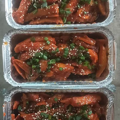 My homemade Chilli Potato is a perfect party snack. It's crispy, tangy, and sweet, and I garnish it with sesame seeds and spring onions.
