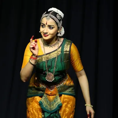 Portraying the Nayika, or heroine, during the Ninada Nruthyotsava. The expression here is one of gentle persuasion, as she speaks to her sakhi (friend).