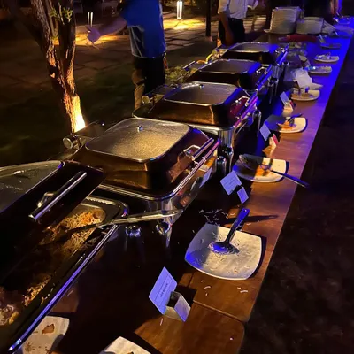 A look at our extensive dinner buffet spread. We offer a variety of dishes, including salads, curries, rice, and dessert, to cater to different tastes and dietary needs.