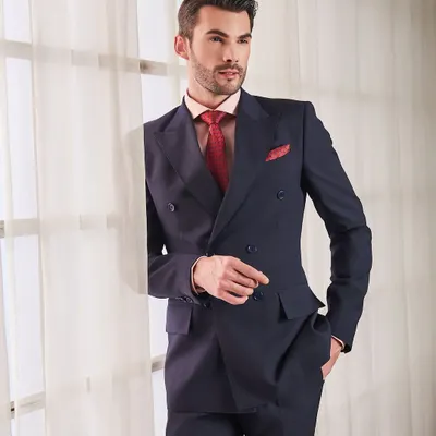 A classic navy double-breasted suit is the definition of power dressing. Tailored to perfection, this suit offers a commanding presence while the premium fabric ensures it remains comfortable throughout the day.