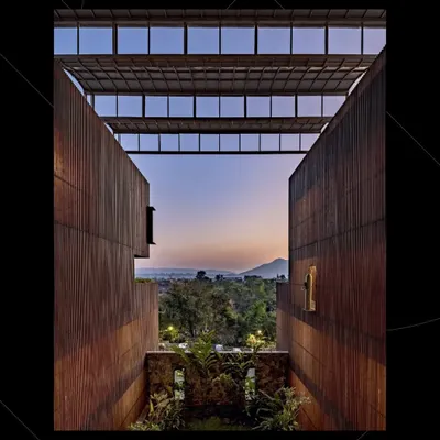 The Radisson Resort in Lonavala received an honorable mention at The Plan Award 2024. The design grapples with the contradiction of urbanizing rural areas, creating a form that connects to nature despite the pressures of building codes and densities.