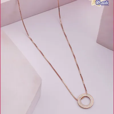 The essence of quiet luxury. This delicate Circle of Eternity pendant in rose gold is a testament to timeless design, perfect for adding a touch of grace to your daily ensemble or for elegant layering.