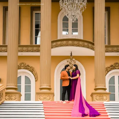 A regal setting for a royal love story. This shot at a palatial location in Bangalore uses grand architecture and a stunning chandelier to frame the couple's intimate moment.