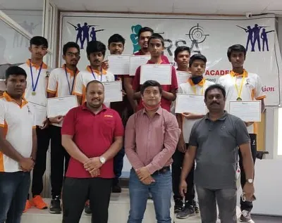 A group of our 2020 competition participants and winners posing with their certificates alongside the coaching staff. We foster a strong sense of community and team spirit.