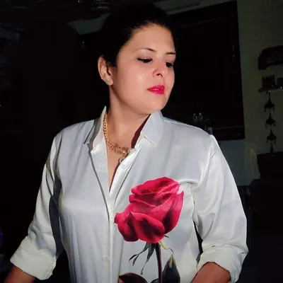 For a party night, I styled myself in a custom white satin shirt with a hand-painted rose, paired with torn denims.