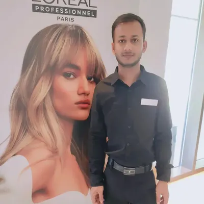 Attending a L'Oreal Professionnel seminar to learn about new products and styling methods. Continuous education is key in the hair industry.