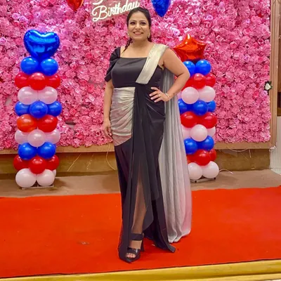My client shines in this classy, custom-made black and silver gown for her birthday. Seeing her look so elegant and happy is why I love what I do.