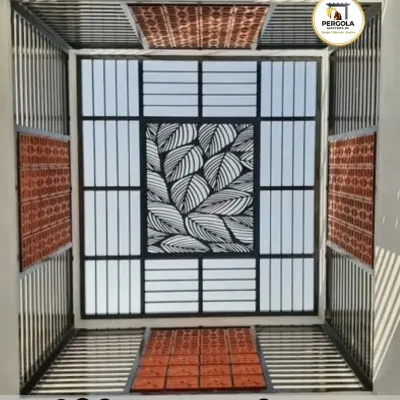 This stunning skylight combines multiple design elements. A central CNC-cut leaf pattern is framed by frosted glass panels and traditional clay tiles, creating a rich, eclectic centerpiece that celebrates light and texture.