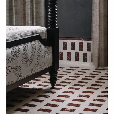 This black four-poster bed was custom-designed for the 'Aria' master bedroom. Its strong, sculptural form stands in beautiful contrast to the patterned marble and IPS flooring, creating a space that feels both peaceful and powerful.