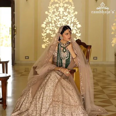 A regal bridal look styled for a Rambhajo's jewellery campaign. The focus was on layering magnificent emerald and polki necklaces over a delicately embroidered lehenga, creating an image of royal grandeur and timeless bridal beauty.