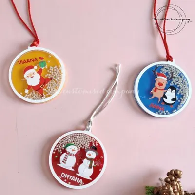 These personalized shaker baubles are a delight to hang on the Christmas tree. Each one is filled with tiny beads and customized with a name, making them a fun and festive ornament for kids and adults alike.