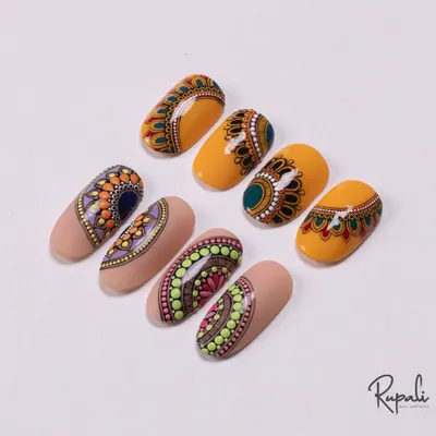 A collection of my original mandala-inspired nail designs. Each one uses a different color palette and pattern, showing the versatility of this art form.
