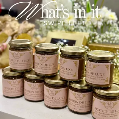 A pyramid of my Protein De Luxe jars, ready to be enjoyed. Each jar is filled with a sumptuous combination of crunchy delight and smooth indulgence that melts effortlessly on your palate.