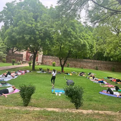 A wide view of one of our large outdoor yoga sessions in a Delhi park. We guide the group collectively, creating a unified flow and a powerful shared experience under the open sky.