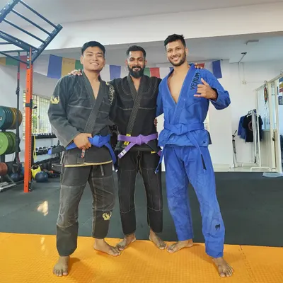 My first colored belts, Jitendra and Long. These two deserve their blue belts for their loyalty, hard work, and success. We don't build sandbaggers here; we build skilled martial artists.