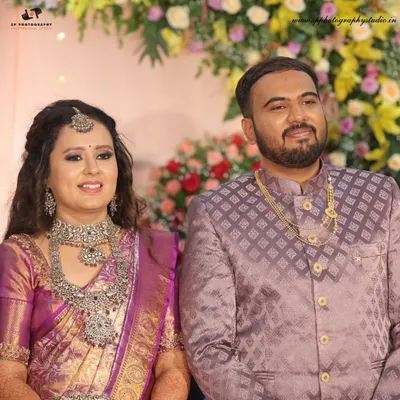A classic portrait of the couple at their reception. Dressed in their finest, this shot captures the elegance and happiness of the evening celebration.