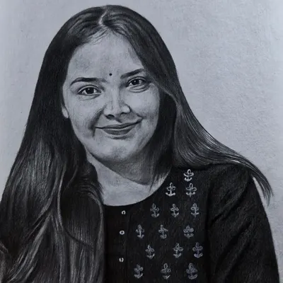 A graphite pencil portrait capturing a gentle smile. I focus on creating a soft, realistic texture for both skin and hair.