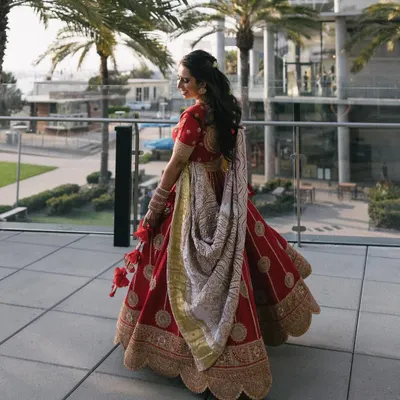 A beautiful shot of the bride in her stunning red Nidhi Tholia lehenga at her sangeet in San Diego. The perfect twirl shot is a must have for every dancing bride.