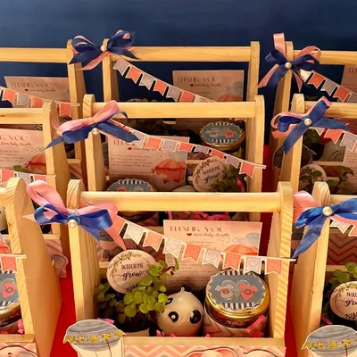 These budget-friendly baby shower hampers are both cute and thoughtful. Each pinewood basket contains a resin planter with a jade plant and a jar of our handmade chocolates.