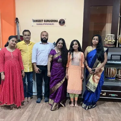 A cherished group photo with students and gurus after a successful examination day.