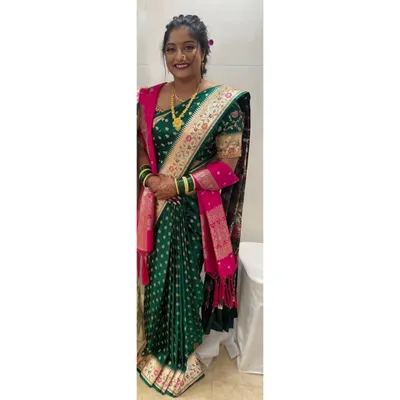 Our client looking lovely in her pre-pleated Banarasi Maharashtrian saree for her engagement. The drape is styled traditionally with a shawl, and our service ensured it was easy for her to wear.