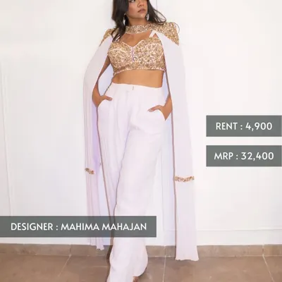 This modern and chic ensemble by Mahima Mahajan features an embroidered gold crop top with an attached cape and sleek white trousers. Originally ₹32,400, you can own it for just ₹4,900.