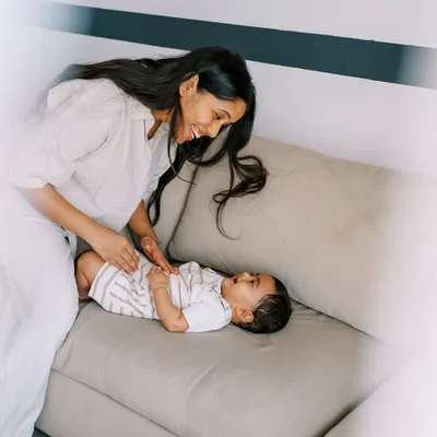 The beautiful light in this house made the indoor part of our shoot truly magical. A mother playing with her baby on the sofa is a simple, perfect moment of connection.