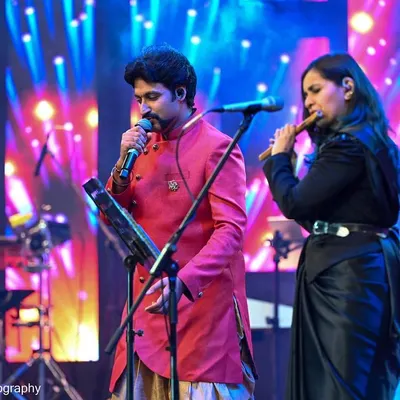 Performing with a fellow vocalist at the Bengaluru Ganesh Utsava. I love the energy of a big stage and sharing my flute and vocal music with a live audience.