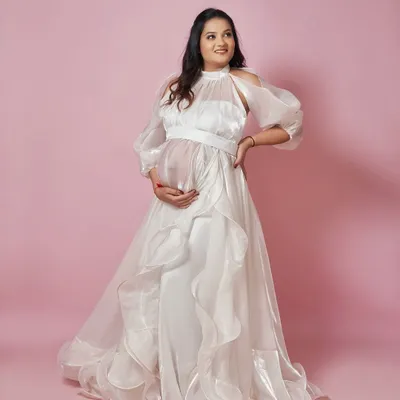 Feel heavenly in our Paradise gown. This angelic white organza dress features cold-shoulder balloon sleeves and a flowing, ruffled skirt for a truly ethereal look.