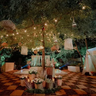 For this engagement party, I created a bohemian-chic vibe with rustic decor elements. The space featured macrame hangings, wicker lanterns, and a cozy tent, all illuminated by warm string lights to create a relaxed and romantic atmosphere.