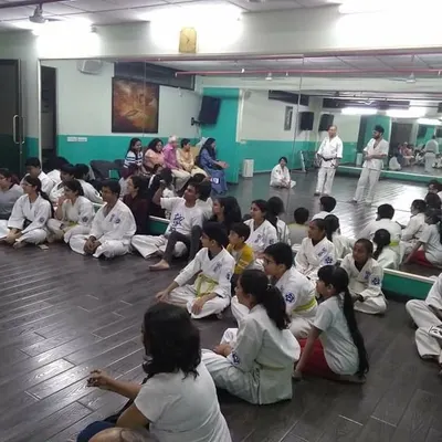 The dojo is a family. Here, students and parents gather to say farewell to Senpai Harjas. These moments of togetherness are just as important as our training on the mat.