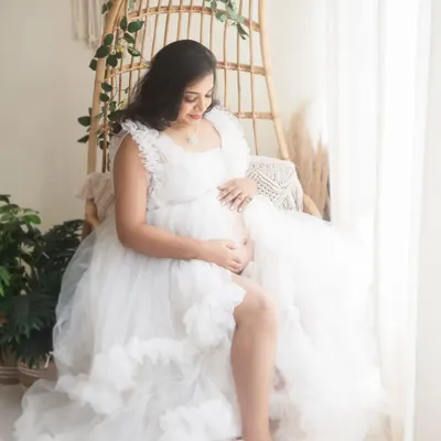 This portrait captures the heart of my boho-themed sessions. The natural textures of the rattan chair and the soft, dreamy light create a peaceful and beautiful atmosphere to celebrate your pregnancy.