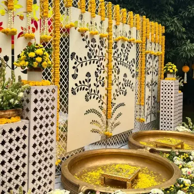 A modern twist on a timeless tradition. This mirror Haldi decor setup reflects the joy of the ceremony, with intricate floral patterns and classic marigold garlands adding a touch of elegance.