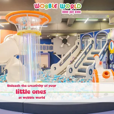 A wide view of our main play structure. This shot shows the multi-level climbing areas, slides, and the central ball pit, all designed to unleash your child's creativity and energy.