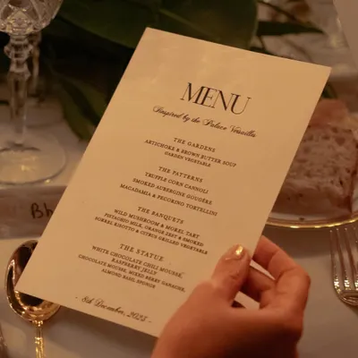 The menu is the first chapter of the story. For our Versailles-inspired dinner, the menu was designed with elegant typography, outlining the four acts of the meal: The Gardens, The Patterns, The Banquets, and The Status.