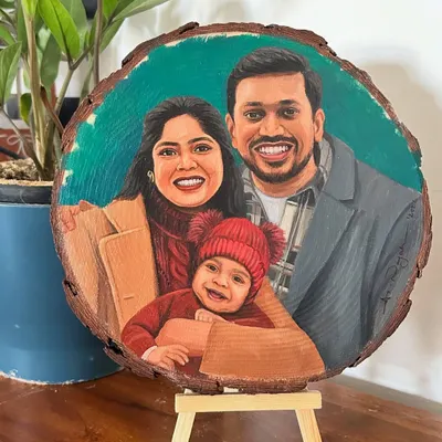 This sweet family portrait was painted on a large, round wood slice. The natural wood border frames the image beautifully, and the vibrant colors pop against the rustic surface.