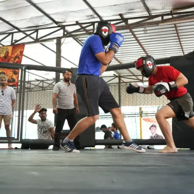A coach's view from the corner. Every exchange in the cage is a learning opportunity, a chance to see strategy unfold in real-time.